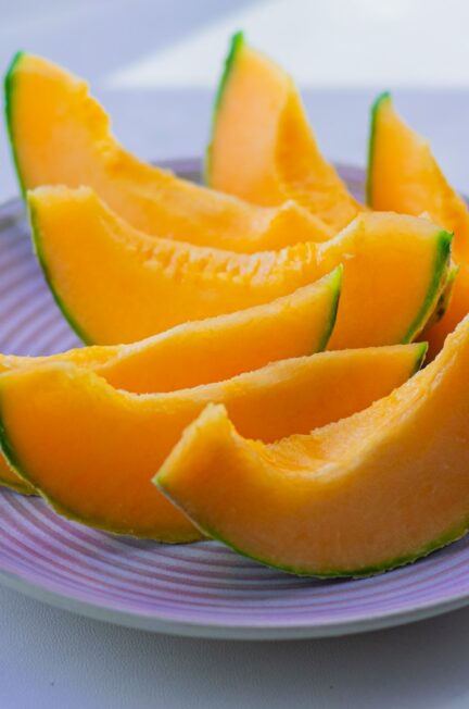 sliced fruit on white ceramic plate